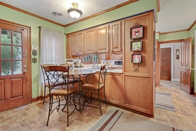 Breakfast nook with kitchen in the background