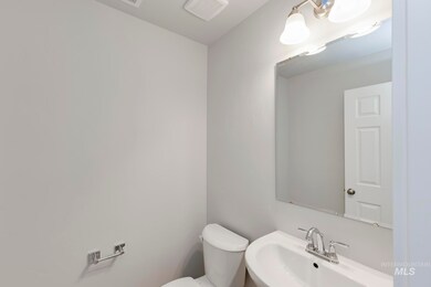 Half bathroom featuring a sink and toilet