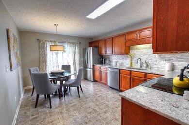 Great kitchen with granite tops and tile back splash.  