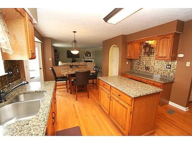 Kitchen. Oak hardwood floor continues from the foy