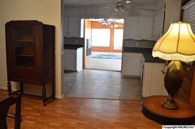 View from the dining room through the kitchen and into the large, light-filled family room.