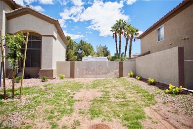 View of yard featuring a gate and fence