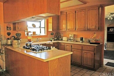 Kitchen with Corian counters and ceramic tile.
