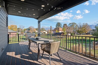 Wooden terrace with a residential view and a yard