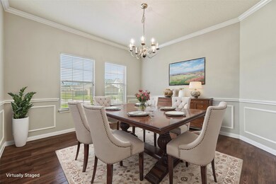 Virtually staged formal dining room.