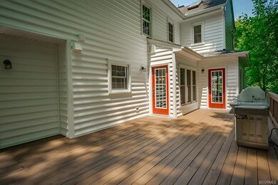 There are three doors leading from the house to th