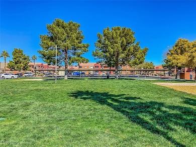 View of grassy area near the community playground