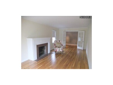 This space also shows off a brick fireplace with w
