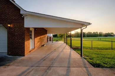Attached carport with access to garage & back patio