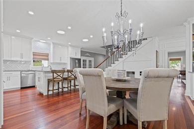 Dining room featuring natural light, crown molding, and recessed lighting