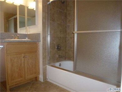 2 REMODELED BATHS WITH GRANITE AND CUSTOM PORCELAI