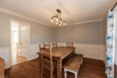 This dining room is large enough for a table/chairs and display pieces.