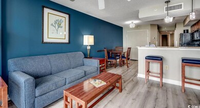 Living area with light wood-style flooring, a textured ceiling, a ceiling fan, and baseboards