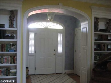 Foyer - Foyer with raised paneled archway.
