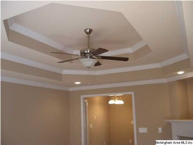 Notice the ceiling and fan in the living room