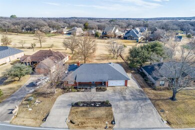 Drone / aerial view. Golf course fairway in back.