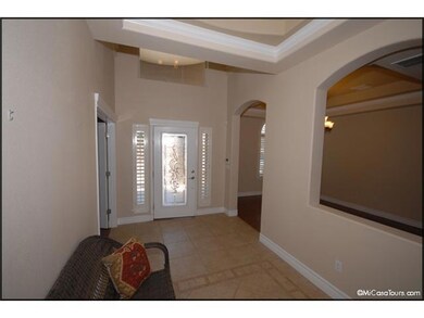 The leaded-glass insert front door is fl