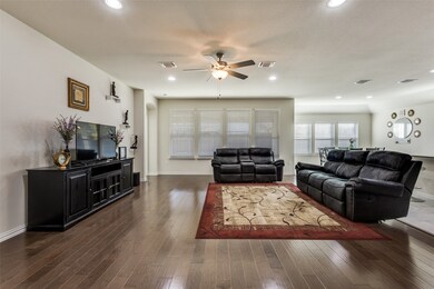 Family Room open to Kitchen with hardwood flooring