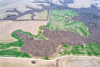Aerial overview of property's location featuring a golf course