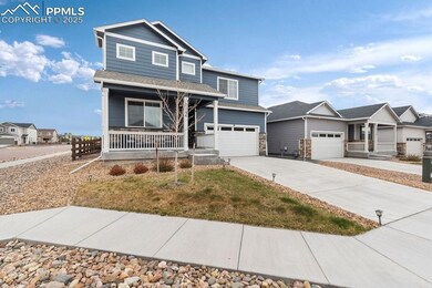 Craftsman-style home featuring a porch and drivewa