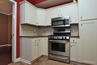 Cooks will enjoy the stainless steel gas range and a built-in microwave hood.