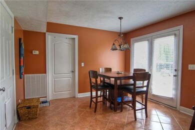 Dining area is conveniently  to kitchen.