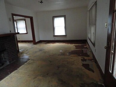 Living Room - Light areas on floor are glue that a