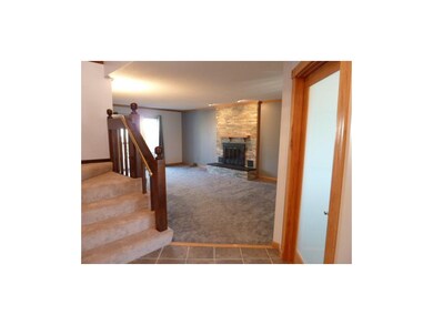Entry looking into the living room's gorgeous ston