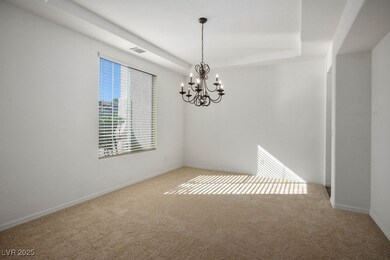Formal Dining room with a chandelier and tall base