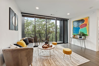 Living room featuring baseboards, visible vents, 