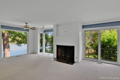 Living area with fireplace and picture windows