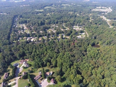 Aerial view of property and surrounding area with 