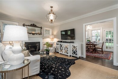 Living room with fireplace and dental molding