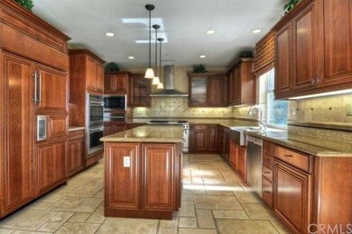 Beautiful rich wood cabinetry, granite counter top