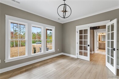 Unfurnished dining area with ornamental molding, f