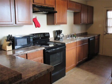 Kitchen appliances are included.