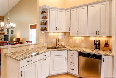 The well equipped kitchen offers lovely granite to