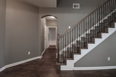 Staircase with hardwood / wood-style floors
