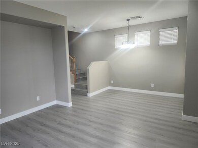 Basement with wood finished floors, baseboards, an