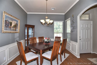 Formal dining has wainscoting that lends an extra