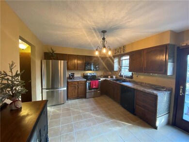 Lovely kitchen with upgraded appliances and French doors to deck