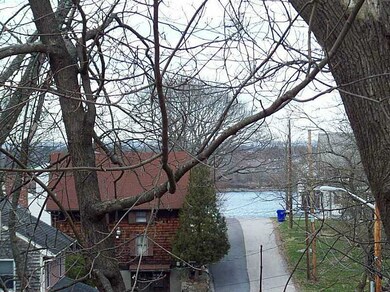 Exterior Front. Seasonal water view from rear