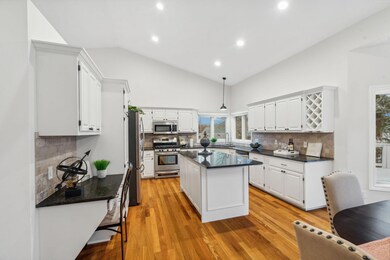 Open concept kitchen with stainless steel appliances