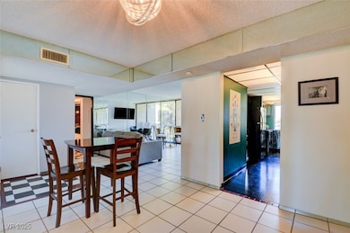 Dining room featuring light tile patterned floors,