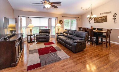 Spacious Great Room with vaulted ceiling, hardwood