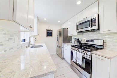 Fully renovated kitchen with recessed lighting hig