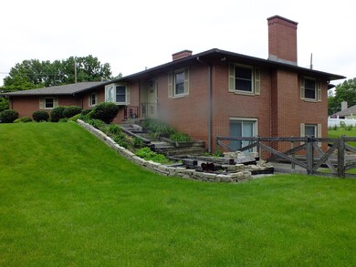 EXTERIOR FRONT AND SIDE OF HOME