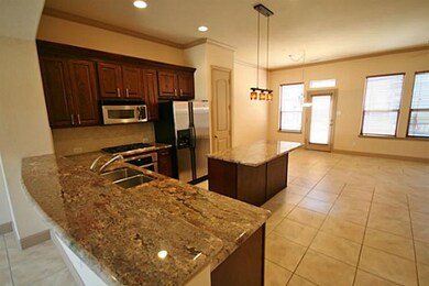 Classy tile floors,the kitchen opens to the living