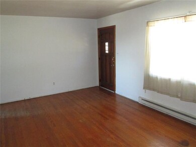 Livingroom is 19x11 Beautiful hardwoods.