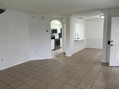 living room view of kitchen and ldinning room